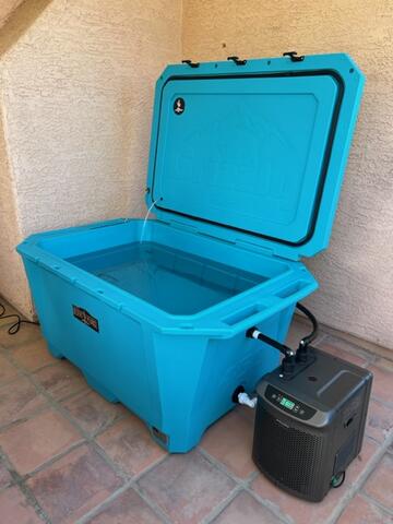 A customer photo of their Desert Plunge 450 Wide Cold Plunge in Teal outside on a patio.