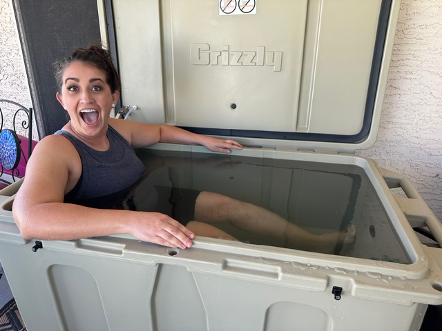 A photo of a woman really enjoying her cold plunge tub from Desert Plunge.