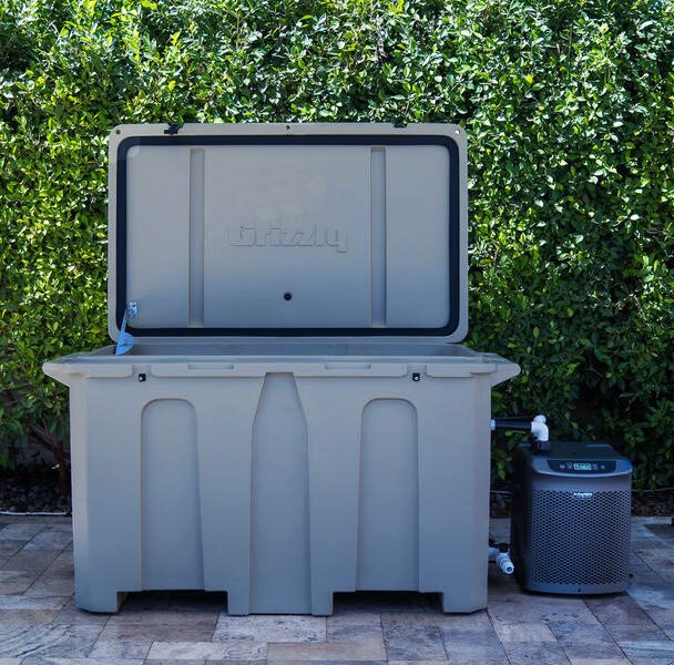 A photograph of a gray 1/4 horsepower cold plunge tub from Desert Plunge outside on a patio.