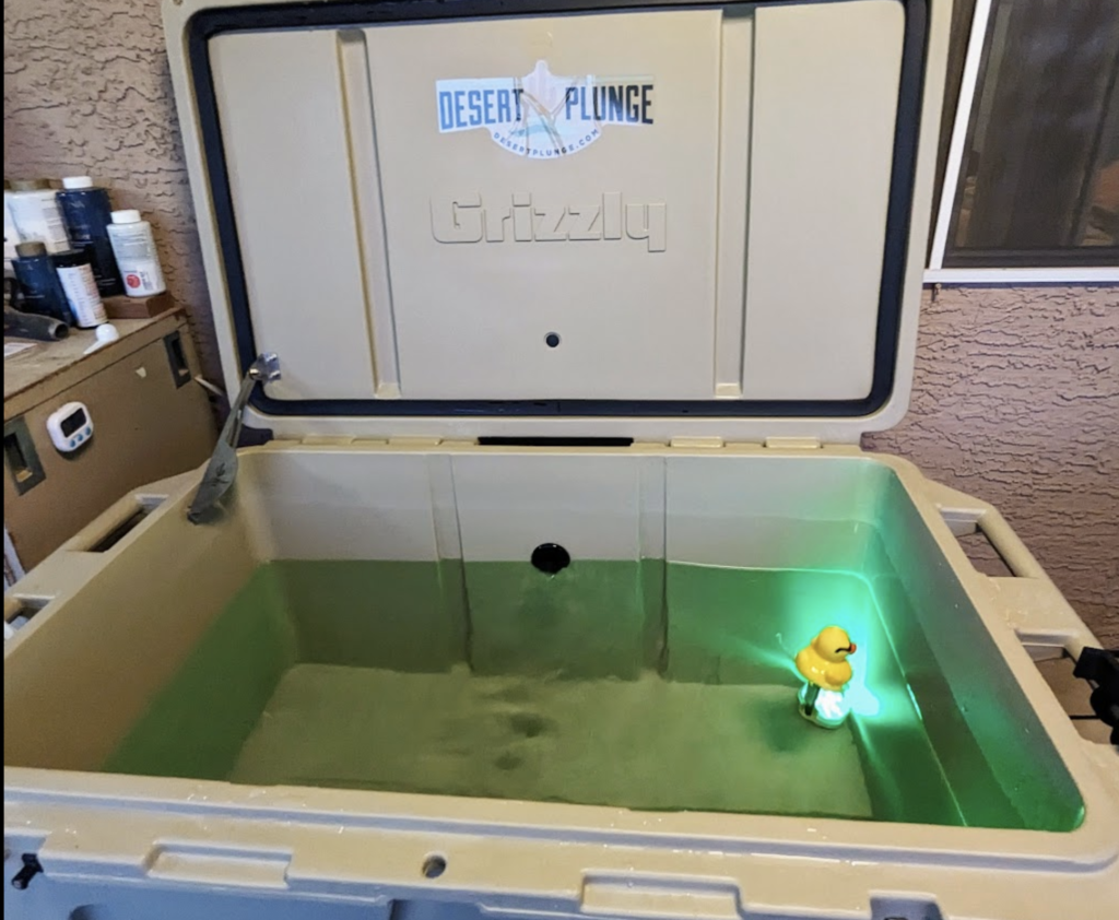 A photo of a Desert Plunge cold plunge tub with a rubber ducky