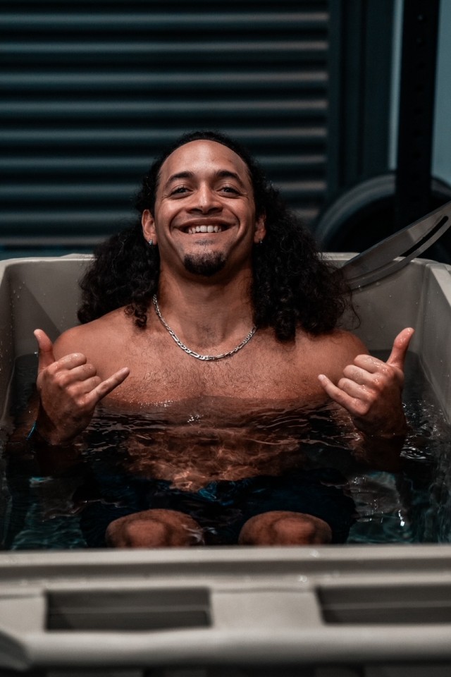 A man showing he loves his cold plunge tub from Desert Plunge.